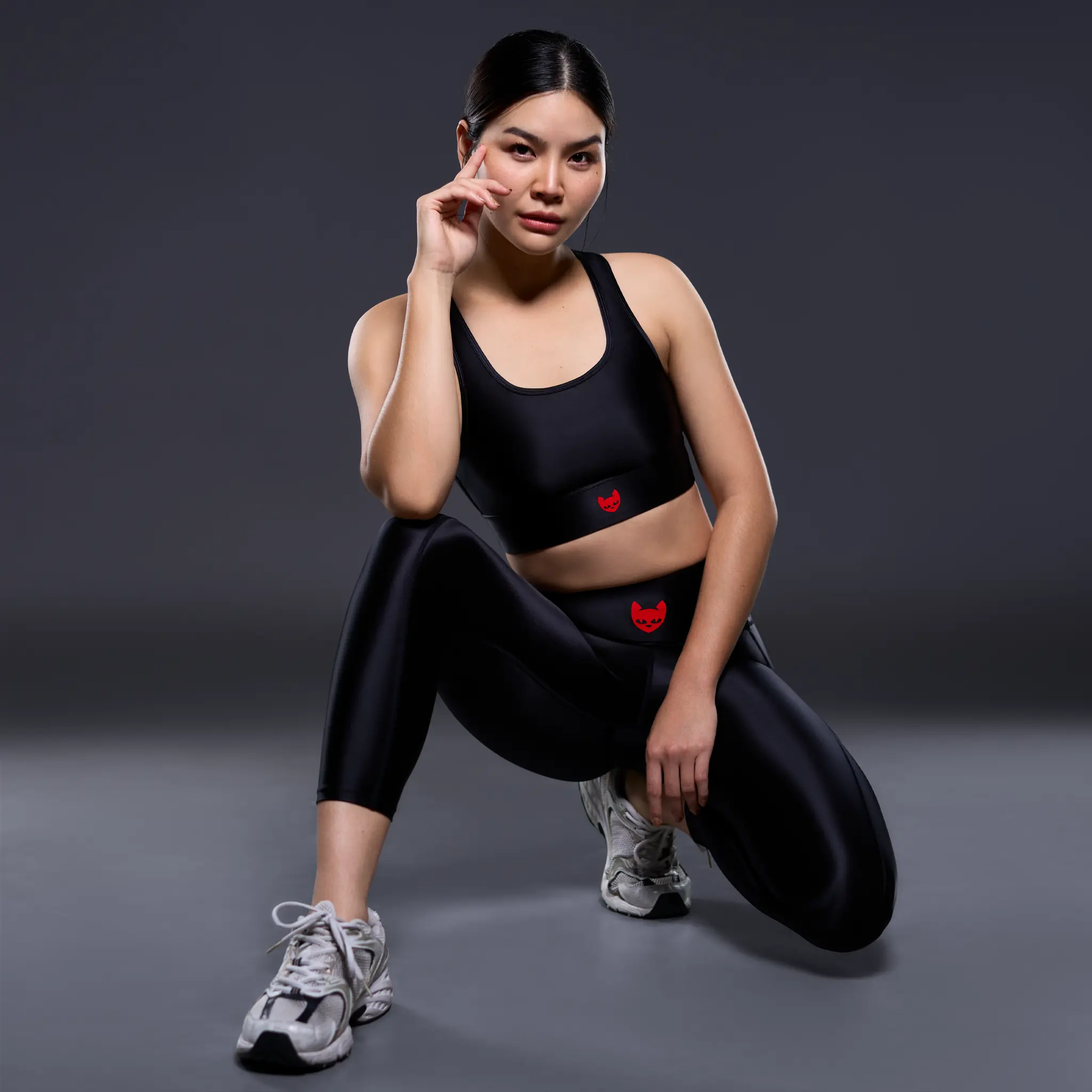 Model wearing black Powerracer sports leggings with a high-rise waistband and glossy finish.