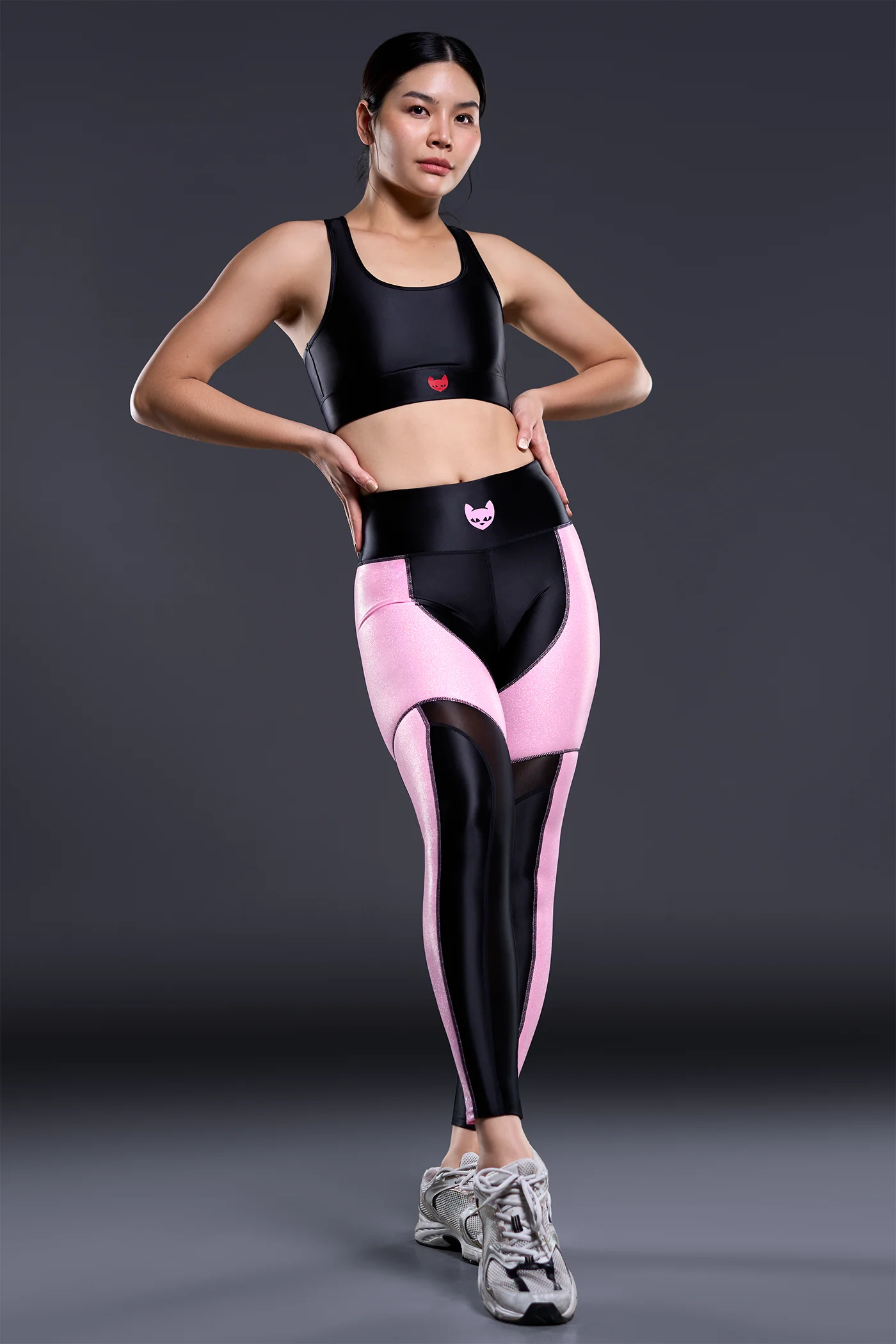 Ultra Rush sports leggings in black satin spandex with light pink sparkle metallic and sheer nylon panels, high rise 7/8 leggings